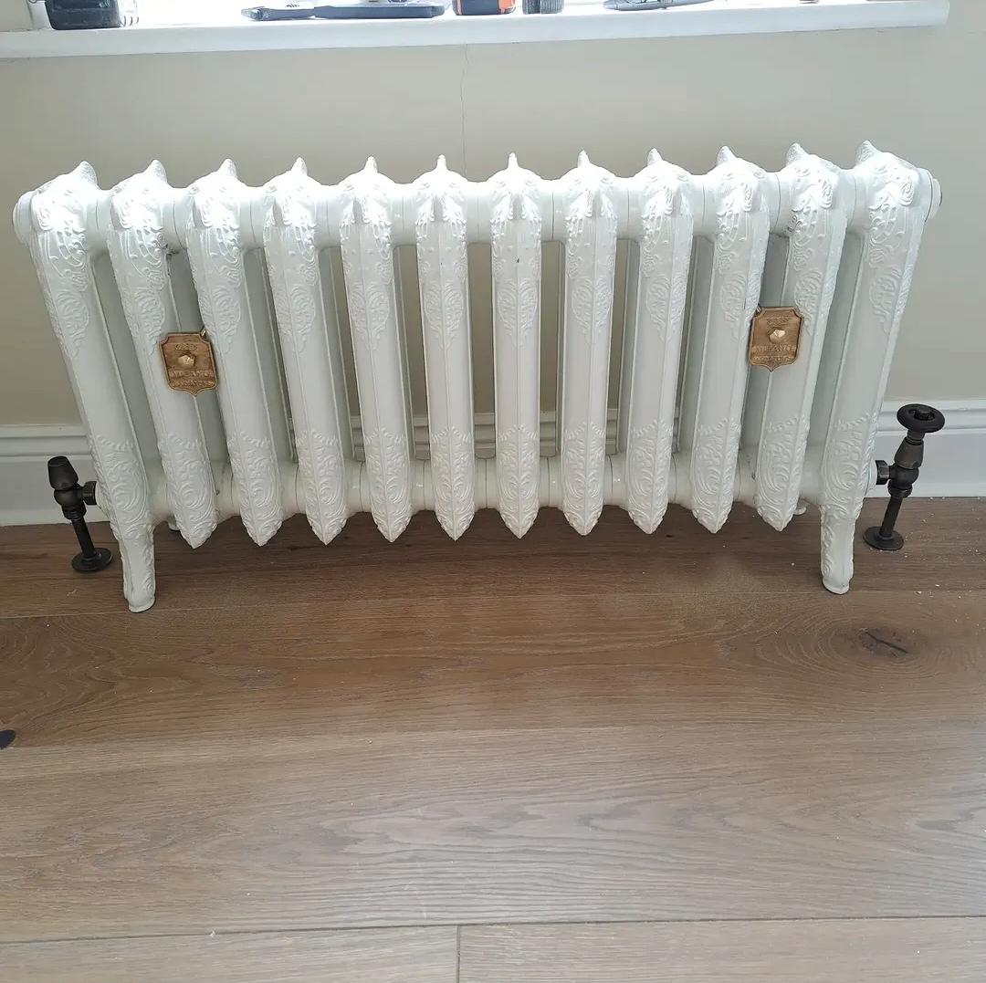 Cast iron column radiator fitted with new radiator valves